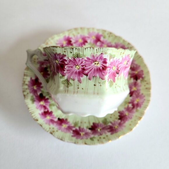 Antique porcelain tea cup with saucer with pink floral design and gold trim. - Picture 10 of 13